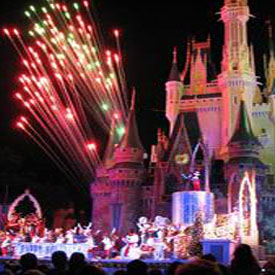 Disneyland castle at night with fireworks in the sky