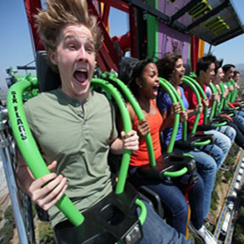 Group of people on the Lex Luthor ride at Six Flags Magic Mountain screaming