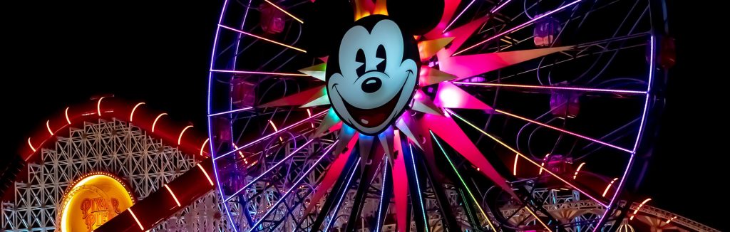 Pixar Pal-A-Round lit up at night in Disneyland California Adventure Park, southern california graduation trips