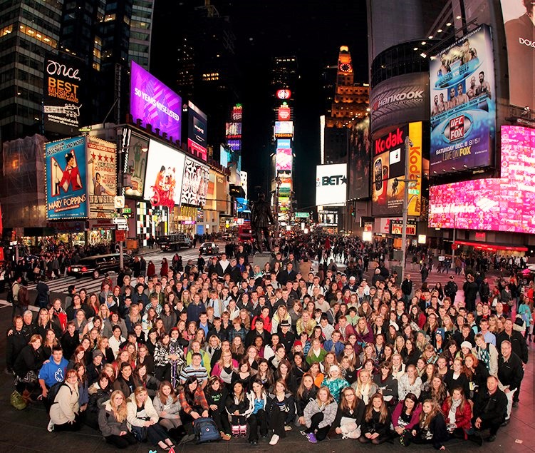 Student choir group performing in New York City on educational tour